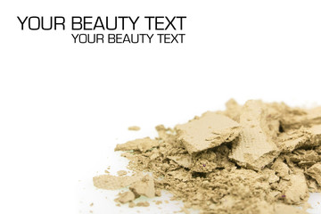 Crushed yellow eyeshadows on white background