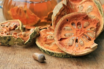 Slices of dried bael fruit and juice