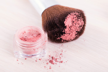 make up brush with red powder