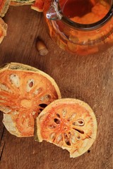 Slices of dried bael fruit and juice