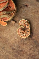 Slices of dried bael fruit and juice