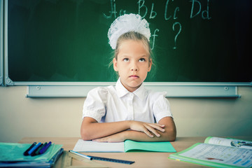 Desktop background of student sitting at desk for classwork