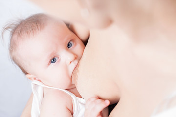 Mother breast feeding a cute baby