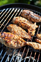 Grilled chicken breast on barbeque