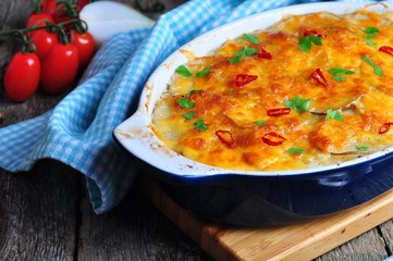 potato casserole with chicken, onions and cheese