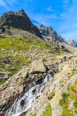 Waterfall in Starolesna valley in summer landscape of High Tatra Mountains, Slovakia