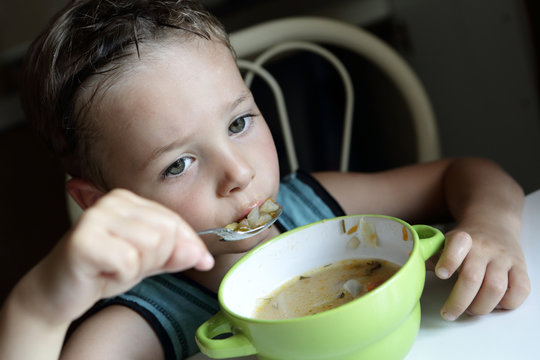 Child Eating Soup