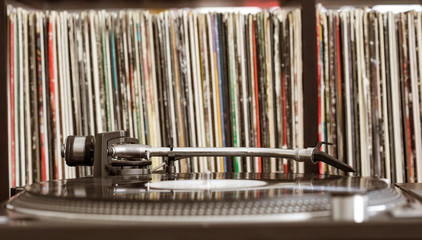 Dj turntable on vinyl background