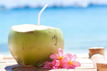 Tropical fresh cocktail on white beach