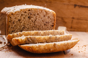 Sliced whole wheat bread on cutting board