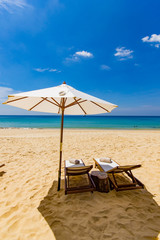 Sunbeds and umbrella at the beach