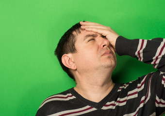 man's hand on his head, depressed. stress, shock