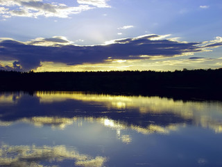 Fototapeta premium Sunset over the lake and forest