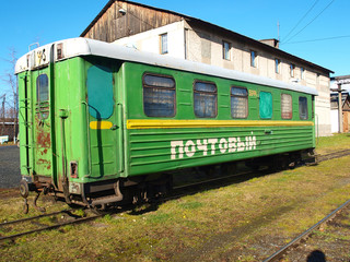 Fototapeta na wymiar Narrow-gauge railway postal wagon. The oldest narrow-gauge railway depot in Russia