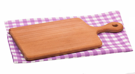 Cutting board isolated on purple checkered tablecloth