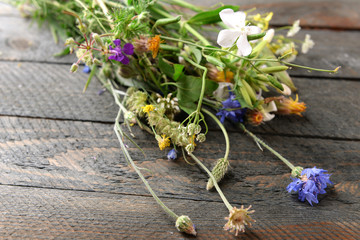 Wildflowers on wooden table, closeup