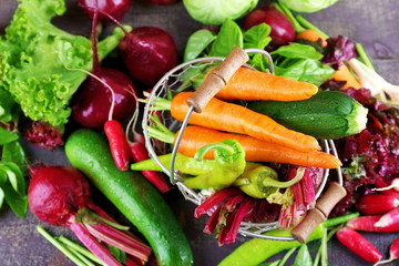 Heap of fresh vegetables on table close up