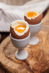 Boiled eggs on a wooden background