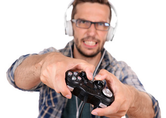 Young man playing video games isolated on white