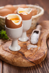 Boiled eggs on a wooden background