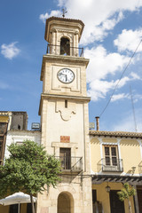 bell tower with a clock in La Mancha square - Chinchilla de Monte Aragon - Albacete - Spain