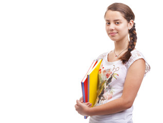 Cute teen girl holding notebooks on white background