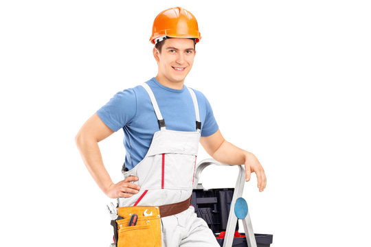 Male electrician standing on a ladder