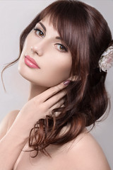 Naklejka premium Beautiful blond girl in the image of a bride with flowers. Beauty face. Wedding