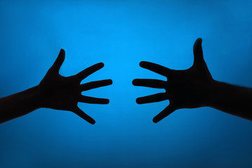 Silhouette of hands close up
