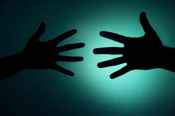 Silhouette of hands close up