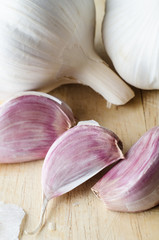 Garlic Bulbs and Cloves on Chopping Board - Close Up