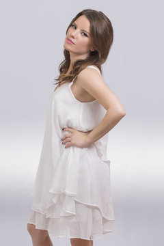 Beautiful girl in a white dress