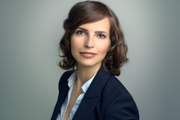 Attractive businesswoman with curly brown hair