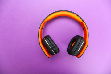 Headphones on purple background