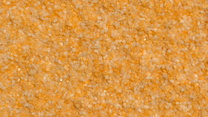 Bright yellow grained background (mineral plaster)