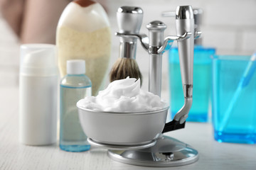 Male luxury shaving kit on shelf, on bricks wall background