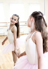 little girl dressed as a ballerina in ballet