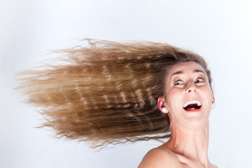 Long hair of woman blowing in head wind