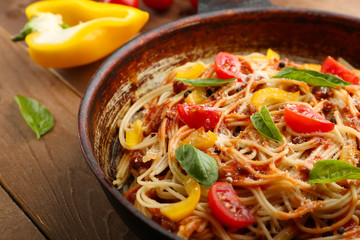 Homemade Spaghetti Bolognese on pan, on wooden background