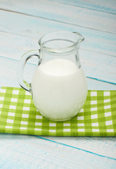 jug of milk on a green checkered tablecloth