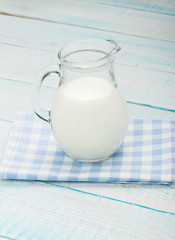 jug of milk on a blue checkered tablecloth