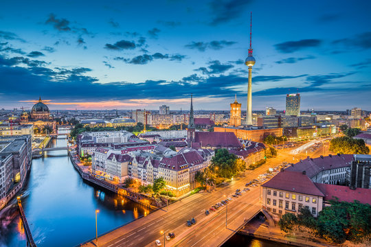 Berlin skyline panorama with dramatic clouds in twilight at dusk, Germany