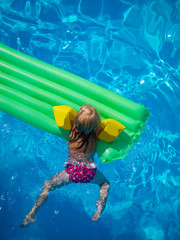 Little girl in the swimming pool