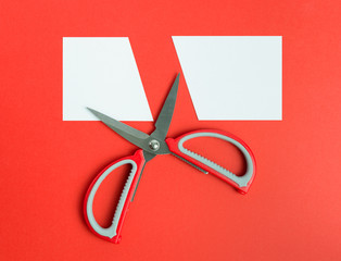Scissors cut white paper
