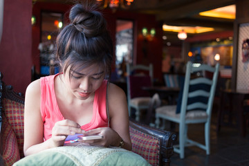 women lifestyle used a mobile phone in cafe coffee shop