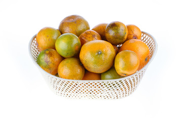 orange fruit in basket, isolated on white background