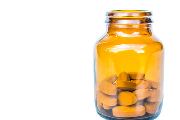 yellow bottle with pills isolated on white background