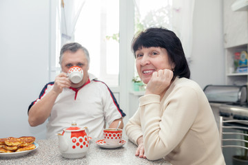  elderly woman and man having breakfast