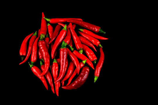 Red Chillis on Black Background