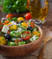 Greek salad with fresh vegetables, feta cheese and black olives
